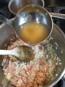 Buzymum - Add stock to the risotto a ladle at a time