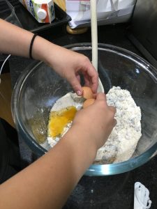 Buzymum - Cracking egg to make the oat and raisin biscuits