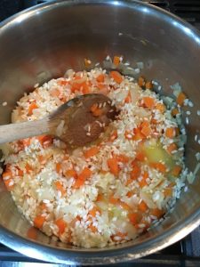Buzymum - Adding stock to the risotto rice