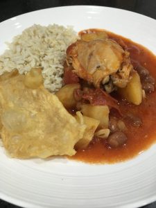 Buzymum - Chicken, tomato and borlotti bean stew served with rice and chicken skin crisps