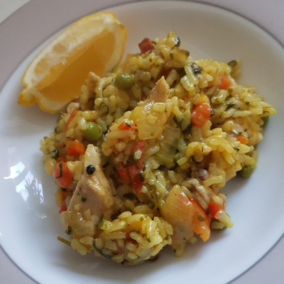 Buzymum - Chicken and chorizo paella served with a wedge of lemon