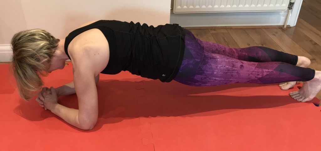 Showing a plank position